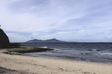 Atauro Island on the horizon seen from a beach behind Cristo Rei, Dili