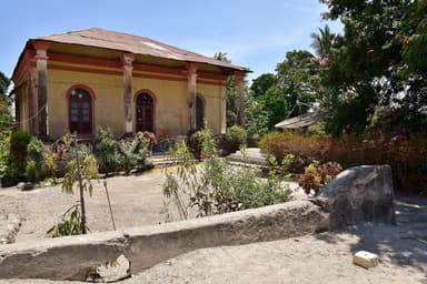 A Portuguese-era building with arched windows in Baucau's old town
