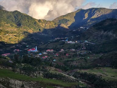 Hato Builico village in a green mountain valley below Mount Ramelau