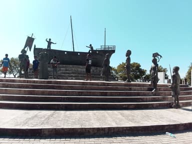 The Lifau monument with statues and a boat, marking the first Portuguese landing in Oecusse