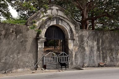 The arched stone gate of the old fort at Maubara